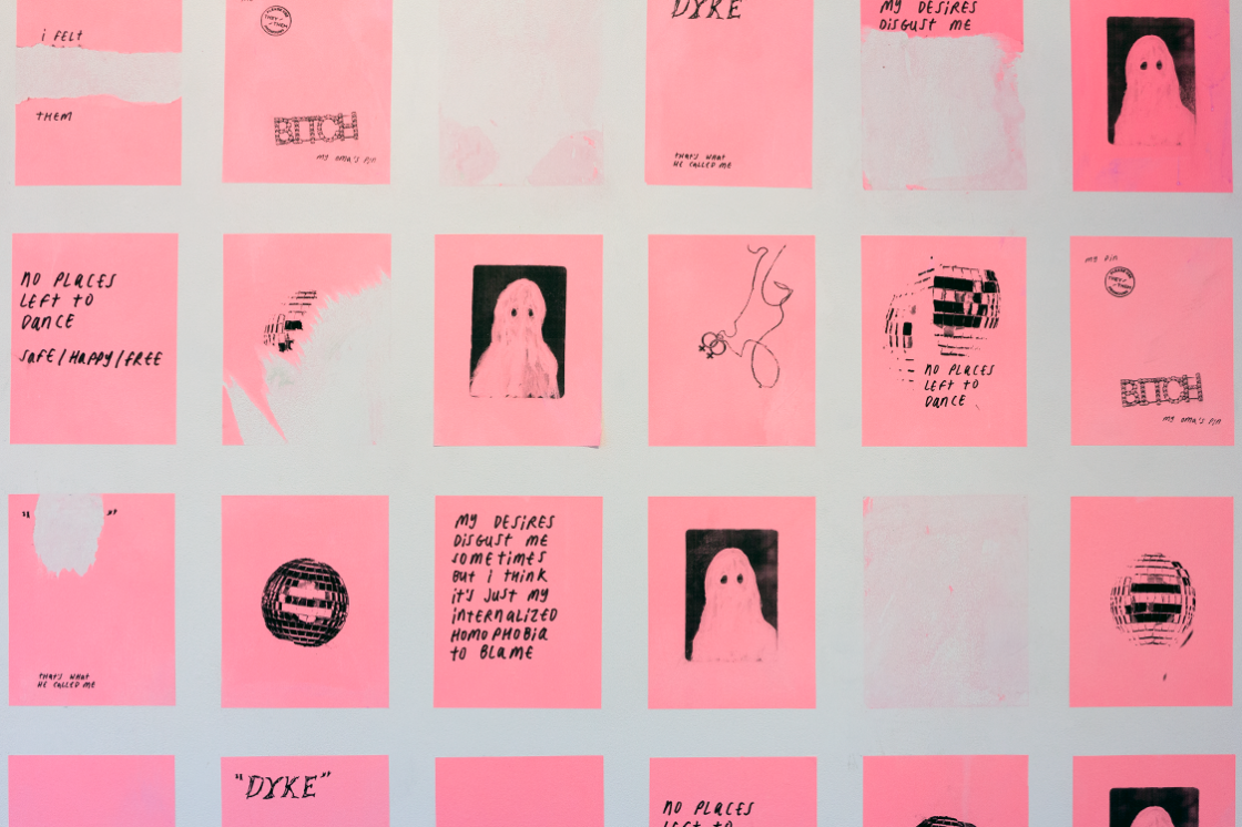 Installation view of the exhibition the space in which we have dissolved, a white wall with neon pink posters in a grid