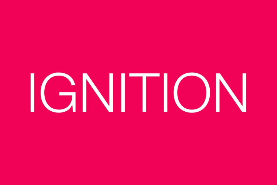 White text that reads "IGNITION" in all capital letters on a bright magenta red background.