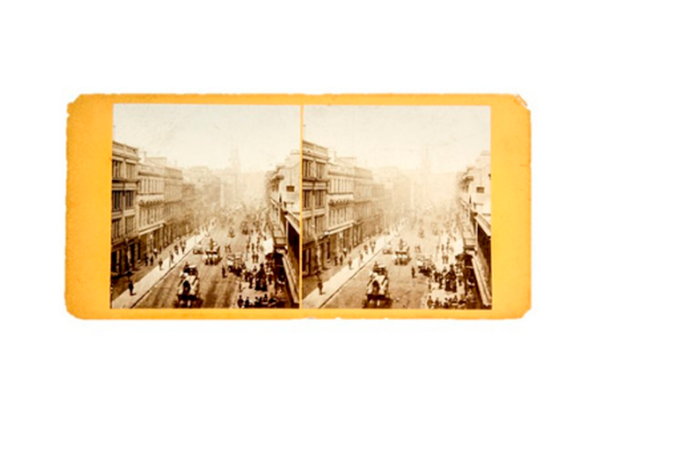 photo of two old photographs of the same streetview from above side by side