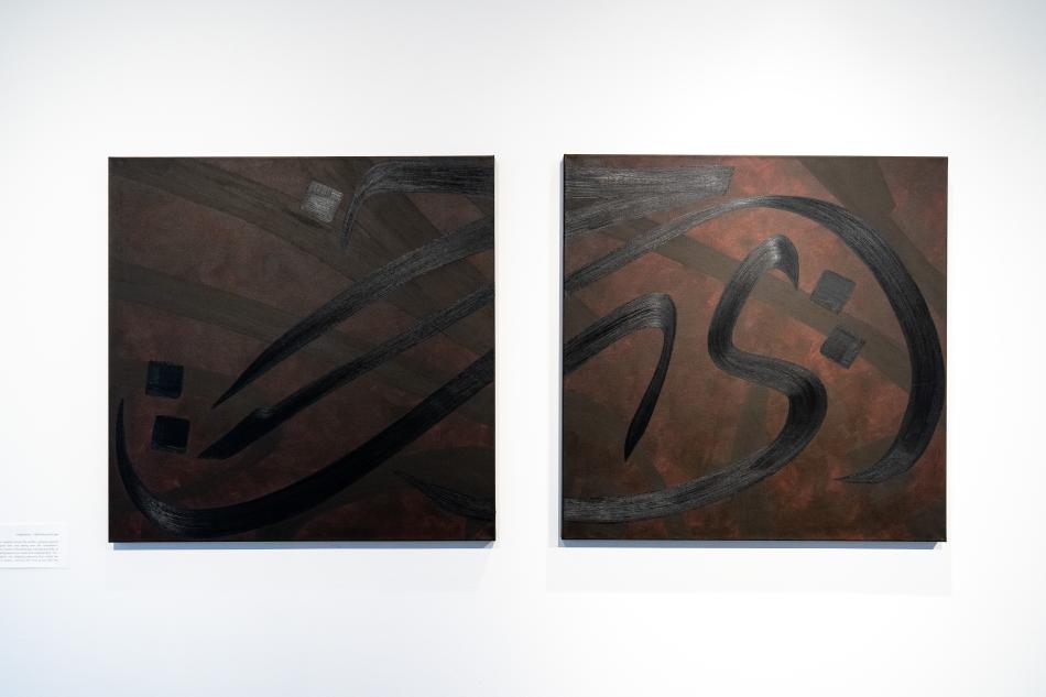 Two of Rania Haider's works placed side by side. They are square, about 2 ft by 2 ft each. There are large Arabic symbols that are loosely painted in the foreground over other faded, brown and orange symbols in the background.